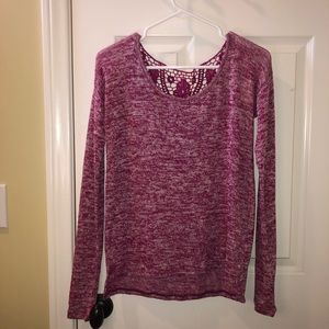 Long sleeve knitted blouse.Laced v back.